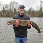 Cem with a 3.3 ft european catfish catch